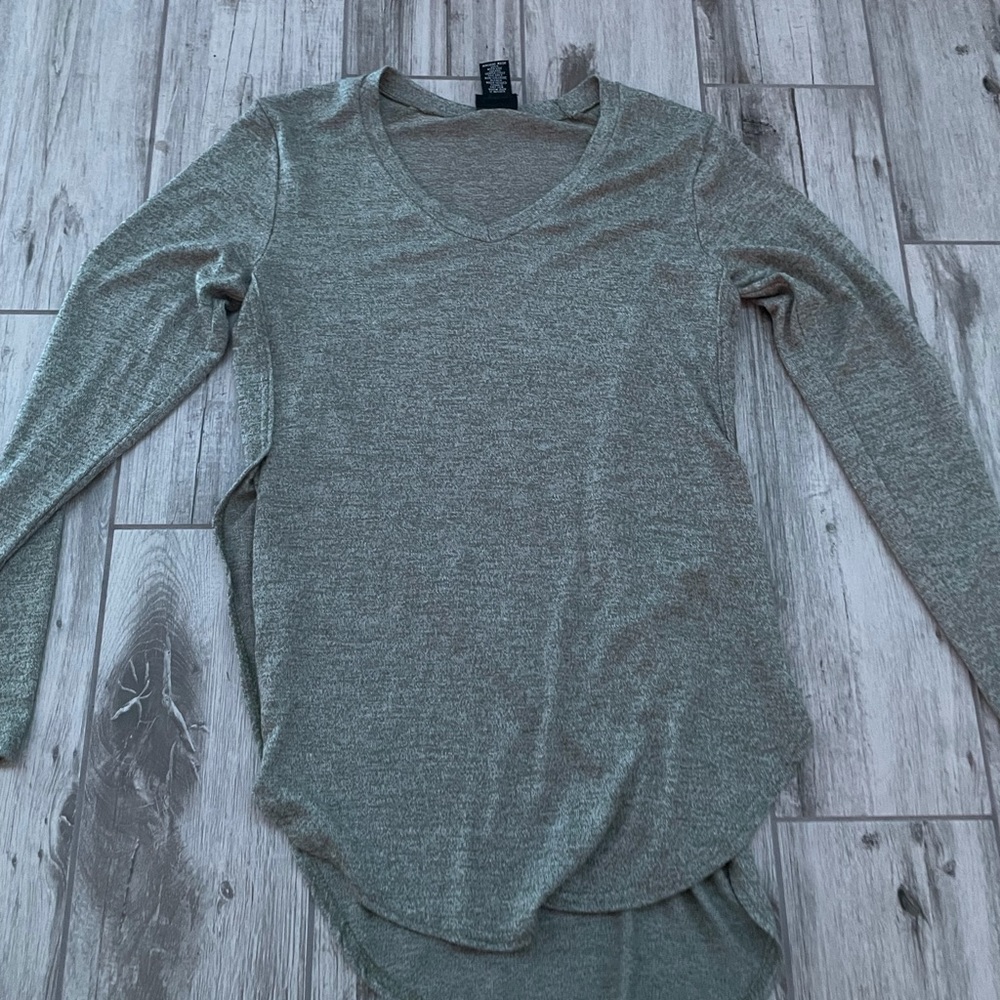 long green shirt that you can tuck into a skirt